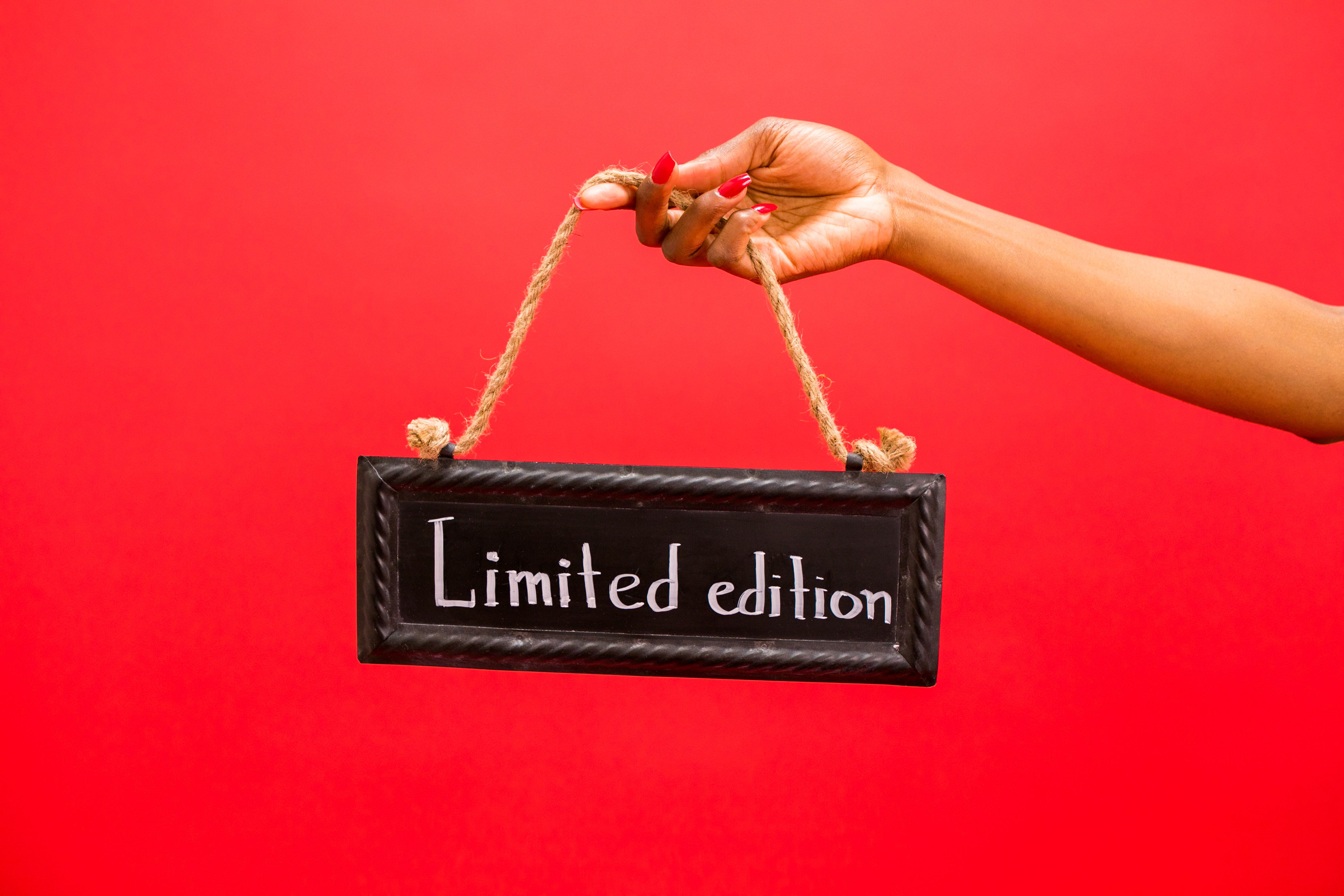 Hand holding a limited edition sign, illustrating scarcity as a product marketing tactic.
